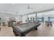 Bright clubhouse with pool table and dining area at 527 Sutton Pl # T-12, Longboat Key, FL 34228