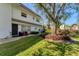 Charming condo with manicured lawn, mature tree, and flowerbeds at 527 Sutton Pl # T-12, Longboat Key, FL 34228