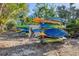 Outdoor storage rack with numerous kayaks available for residents at 527 Sutton Pl # T-12, Longboat Key, FL 34228