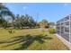 Spacious backyard with lush landscaping and canal view at 5388 Pamela Wood Way # 8, Sarasota, FL 34233