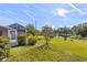 Backyard view showcasing a canal and lush greenery at 5388 Pamela Wood Way # 8, Sarasota, FL 34233