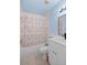 Bathroom features a shower/tub combo, white vanity, and floral shower curtain at 5388 Pamela Wood Way # 8, Sarasota, FL 34233