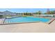 Community pool with adjacent tennis courts at 5388 Pamela Wood Way # 8, Sarasota, FL 34233