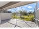 Relaxing screened patio with view of backyard and pond at 5388 Pamela Wood Way # 8, Sarasota, FL 34233