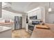 Modern kitchen featuring stainless steel appliances, white cabinets, and ample counter space at 5507 Country Lakes Trl, Sarasota, FL 34243