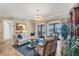 Elegant living room with french doors, stylish furniture, and chic chandelier at 5507 Country Lakes Trl, Sarasota, FL 34243