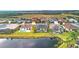 Aerial view of homes with pools near a lake, showcasing a tranquil community at 5703 52Nd W Ave, Bradenton, FL 34210