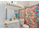 Bright bathroom with white vanity, updated fixtures, and a shower/tub combo at 5703 52Nd W Ave, Bradenton, FL 34210