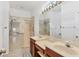 Bathroom features double sinks, large shower, and light beige tile at 5703 52Nd W Ave, Bradenton, FL 34210