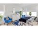 Bedroom with two armchairs, dresser, and a blue and white themed bed at 5703 52Nd W Ave, Bradenton, FL 34210