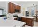 L-shaped kitchen with stainless steel appliances and white countertops at 5703 52Nd W Ave, Bradenton, FL 34210