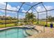 Enjoy this screened pool and spa with a spa and lake view at 5703 52Nd W Ave, Bradenton, FL 34210