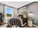 Guest bedroom with window, unique headboard and stylish bedding at 5703 Tripoli Dr, Palmetto, FL 34221