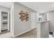 Bright hallway with modern wall art and linen closet at 5703 Tripoli Dr, Palmetto, FL 34221