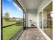 Relaxing screened patio with brick pavers and backyard view at 5703 Tripoli Dr, Palmetto, FL 34221