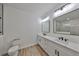 Modern bathroom with double vanity, quartz countertop and large mirror at 5923 22Nd Avenue E Dr, Palmetto, FL 34221