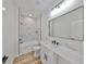 Modern bathroom with white cabinets and marble shower at 5923 22Nd Avenue E Dr, Palmetto, FL 34221