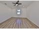 Spacious bedroom with hardwood floors and ceiling fan at 5923 22Nd Avenue E Dr, Palmetto, FL 34221