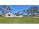 Modern farmhouse exterior with driveway and lawn at 5923 22Nd Avenue E Dr, Palmetto, FL 34221