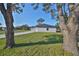 House exterior showcasing side yard and trees at 5923 22Nd Avenue E Dr, Palmetto, FL 34221