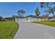 Modern farmhouse exterior with driveway and lawn at 5923 22Nd Avenue E Dr, Palmetto, FL 34221