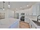 Modern kitchen with white cabinets and quartz countertops at 5923 22Nd Avenue E Dr, Palmetto, FL 34221