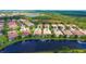 Community aerial view showcasing waterfront properties and lush greenery at 6063 Benevento Dr, Sarasota, FL 34238