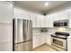 Well-equipped kitchen with stainless steel appliances and quartz countertops at 6063 Benevento Dr, Sarasota, FL 34238