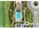 Resort-style pool with surrounding landscaping and parking at 6086 Worsham Ln # 102, Bradenton, FL 34211