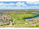 Aerial view of community with golf course and homes at 6086 Worsham Ln # 102, Bradenton, FL 34211