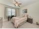 Bedroom with desk workspace and ceiling fan at 6086 Worsham Ln # 102, Bradenton, FL 34211