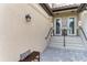 Private entry with a bench and double doors at 6086 Worsham Ln # 102, Bradenton, FL 34211