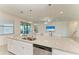 Kitchen island with granite countertop and stainless steel sink at 6086 Worsham Ln # 102, Bradenton, FL 34211