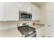 Modern kitchen with stainless steel appliances and granite countertops at 6086 Worsham Ln # 102, Bradenton, FL 34211