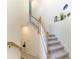 Elegant staircase with wood railings and carpeted steps at 6086 Worsham Ln # 102, Bradenton, FL 34211