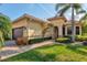 House exterior showcasing a front walkway and mature shrubs at 6207 27Th E St, Ellenton, FL 34222