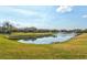 Community lake with fountain and homes with lush landscaping at 6207 27Th E St, Ellenton, FL 34222