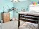 ' bedroom with a bunk bed, cute decor, and colorful accents, creating a fun and inviting space at 6218 Apple Snail Ave, New Port Richey, FL 34653