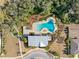 Bird's-eye view of a community pool with lounge area and greenery, providing a relaxing neighborhood amenity at 6218 Apple Snail Ave, New Port Richey, FL 34653