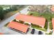 Aerial image showing a building with a red tile roof and carport at 6666 Draw Ln # 132, Sarasota, FL 34238