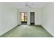 Carpeted bedroom with sliding glass doors to a screened patio at 6666 Draw Ln # 132, Sarasota, FL 34238