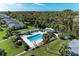 Aerial view of community pool, surrounded by lush landscaping, creating a private oasis for residents at 6939 W Country Club N Dr # 158, Sarasota, FL 34243