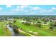 Aerial image features a lush golf course with water features, sand traps, mature trees, and golf cart paths at 6939 W Country Club N Dr # 158, Sarasota, FL 34243