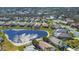 Aerial view of a beautiful community with houses,ponds and lush greenery at 6978 Superior Street Cir, Sarasota, FL 34243