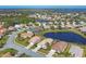 Community overview featuring lake and numerous homes at 6978 Superior Street Cir, Sarasota, FL 34243