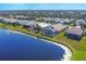 Lakefront homes with lush landscaping and pools at 6978 Superior Street Cir, Sarasota, FL 34243