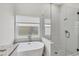 Modern bathroom with soaking tub and glass shower at 6978 Superior Street Cir, Sarasota, FL 34243