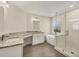 Elegant bathroom with a soaking tub, walk-in shower, and granite vanity at 6978 Superior Street Cir, Sarasota, FL 34243