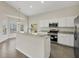 Modern kitchen with stainless steel appliances and granite countertops at 6978 Superior Street Cir, Sarasota, FL 34243