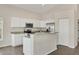 White kitchen cabinets, granite counters, and stainless steel appliances at 6978 Superior Street Cir, Sarasota, FL 34243